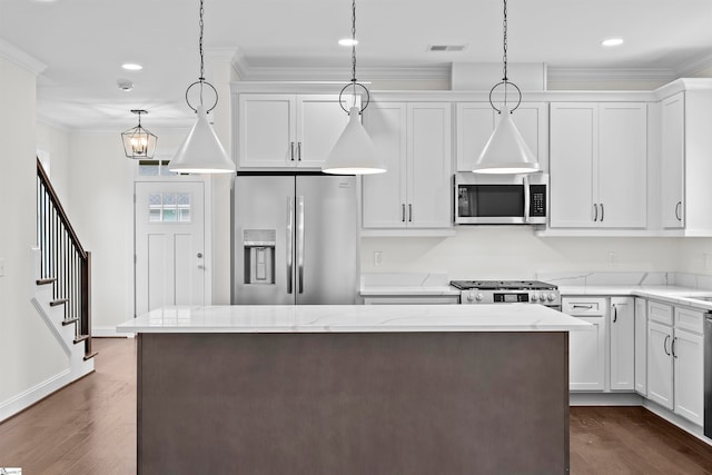 kitchen with white cabinetry, pendant lighting, and appliances with stainless steel finishes