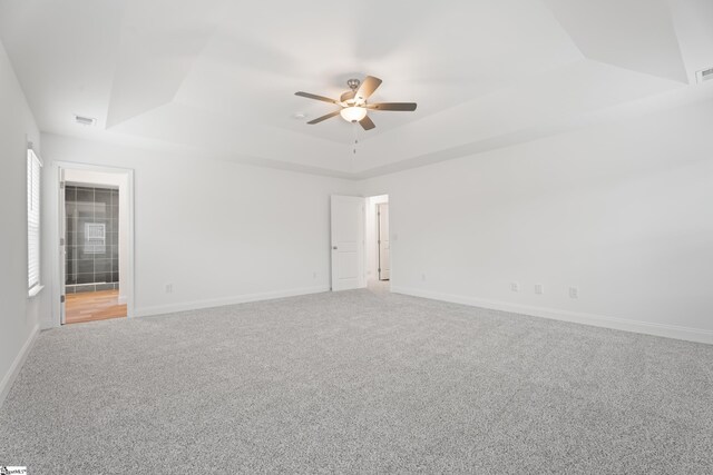 3361 Navin Trl, Roebuck, SC 29376 - empty room featuring a tray ceiling, a ceiling fan, light colored carpet, and baseboards
