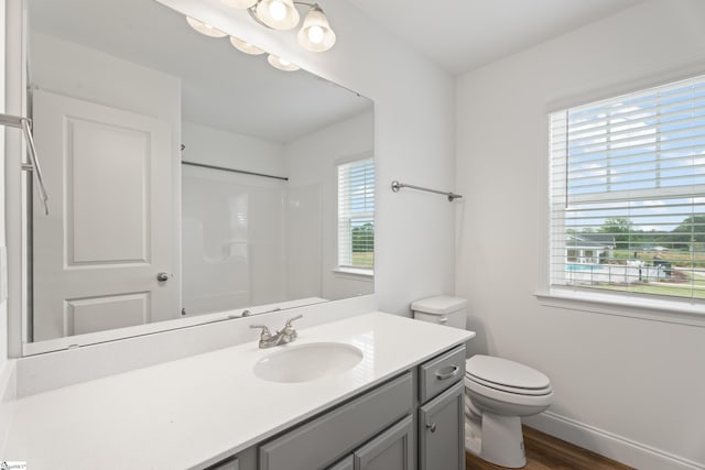 3361 Navin Trl, Roebuck, SC 29376 - bathroom featuring toilet, vanity, wood finished floors, a shower, and baseboards