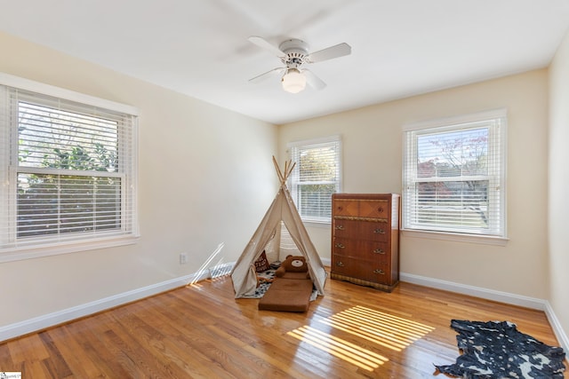 interior space with ceiling fan and light wood-type flooring