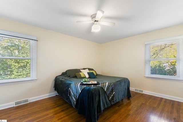 bedroom featuring ceiling fan and dark hardwood / wood-style floors