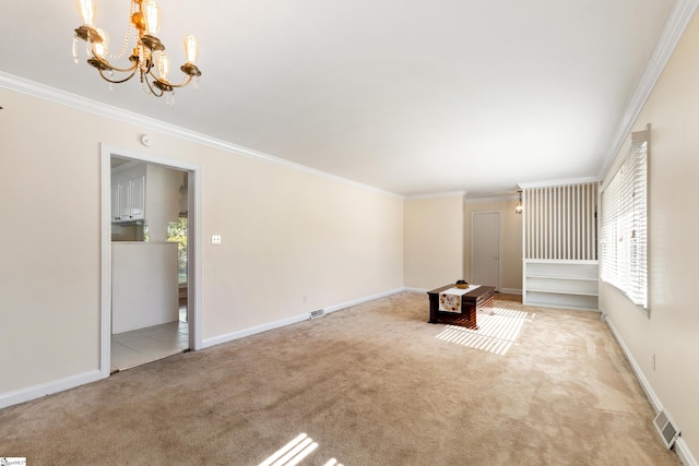 unfurnished living room with light colored carpet, an inviting chandelier, and ornamental molding