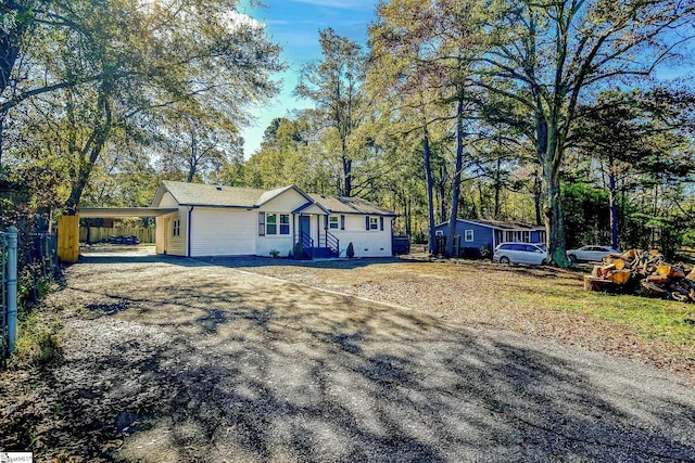 single story home featuring a carport