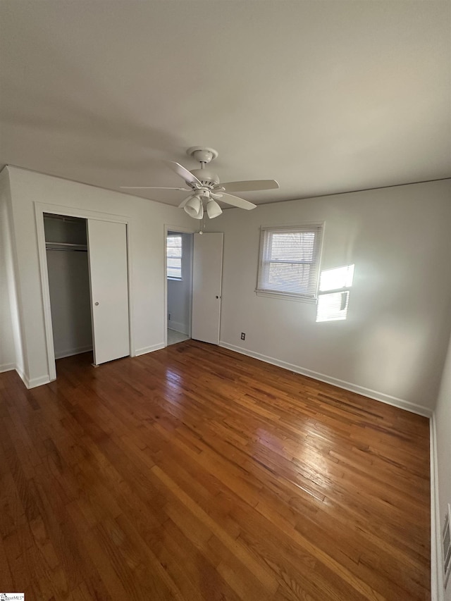 unfurnished bedroom with ceiling fan and hardwood / wood-style floors