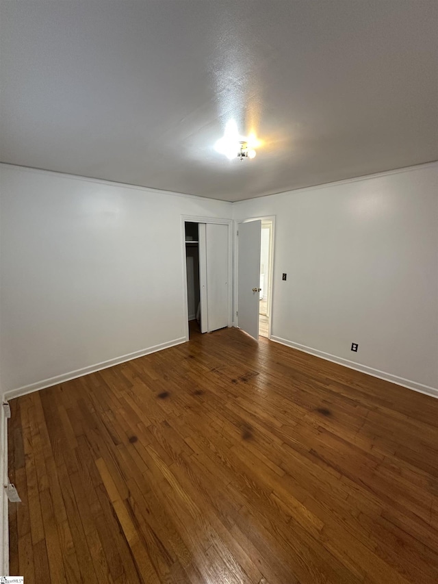 spare room featuring dark hardwood / wood-style floors