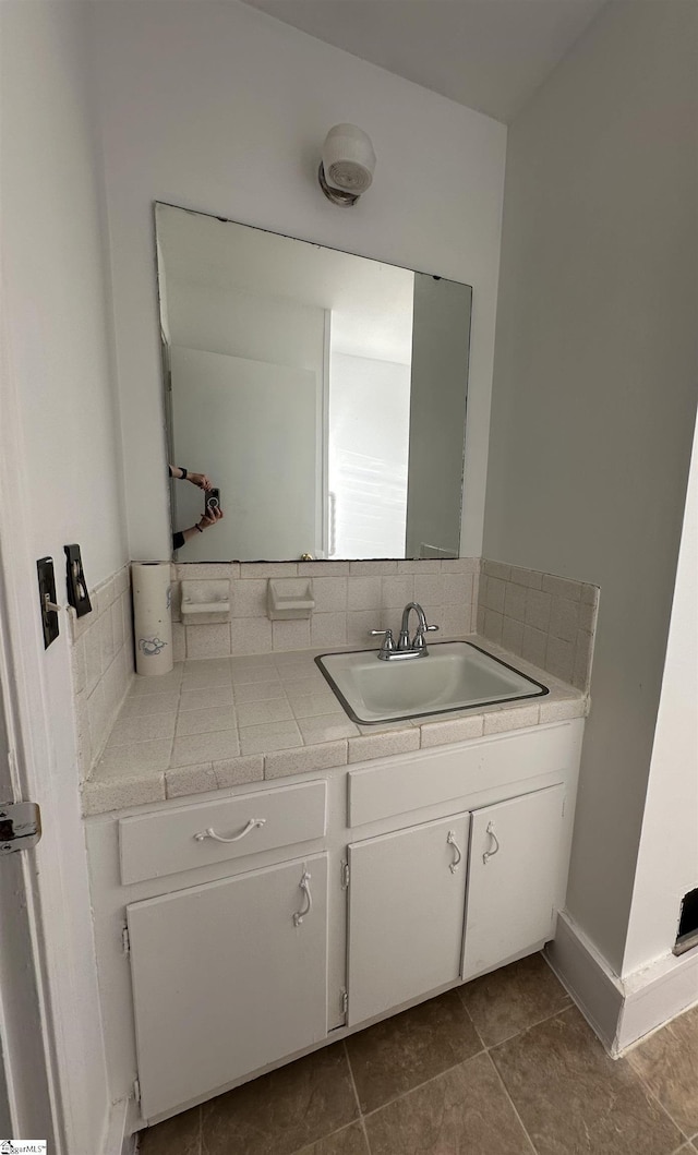 bathroom with tile patterned floors and vanity