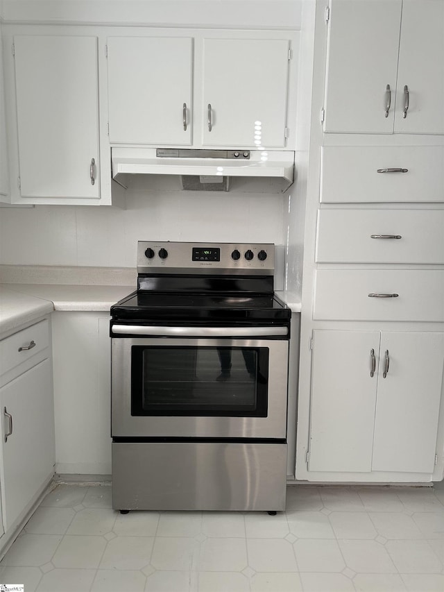 kitchen featuring white cabinetry and electric stove