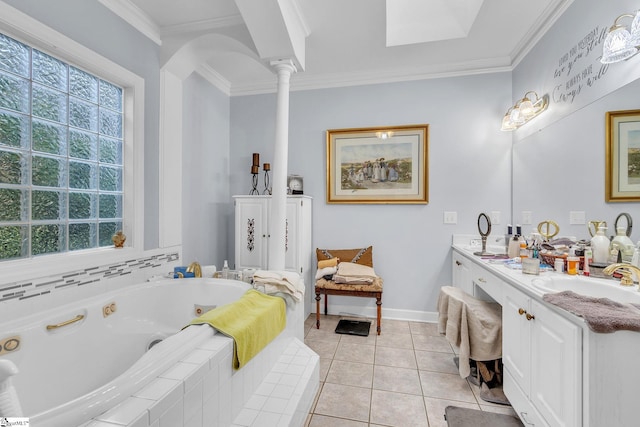 bathroom featuring ornamental molding, vanity, tile patterned flooring, ornate columns, and a tub with jets