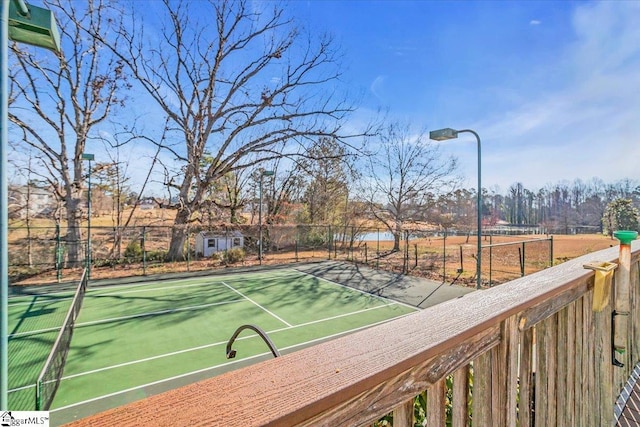 view of tennis court with fence