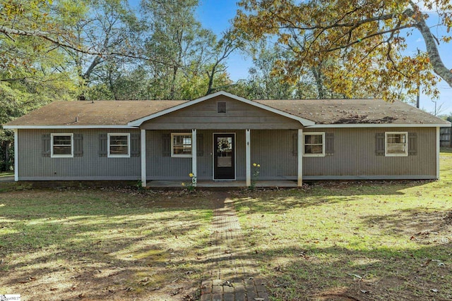 single story home with a porch and a front lawn