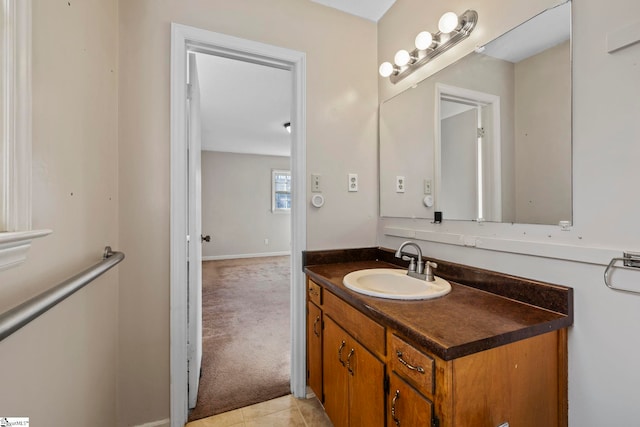 bathroom with tile patterned flooring and vanity