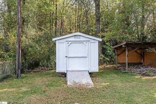 view of outdoor structure with a yard