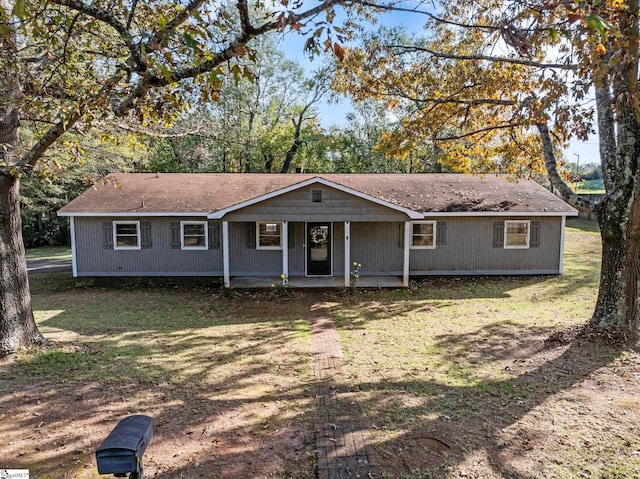 single story home featuring a front lawn and a porch