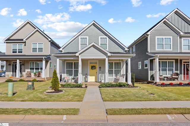 craftsman-style house featuring a front lawn and a porch