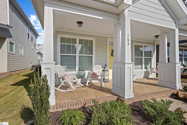 property entrance with covered porch