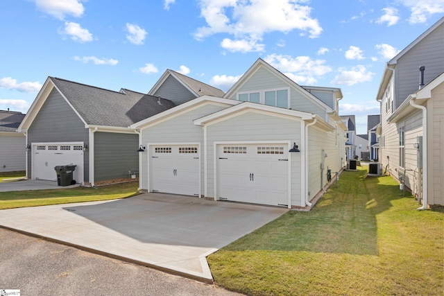 view of front of property with a front yard, a garage, and central air condition unit