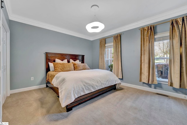 bedroom with crown molding and light carpet