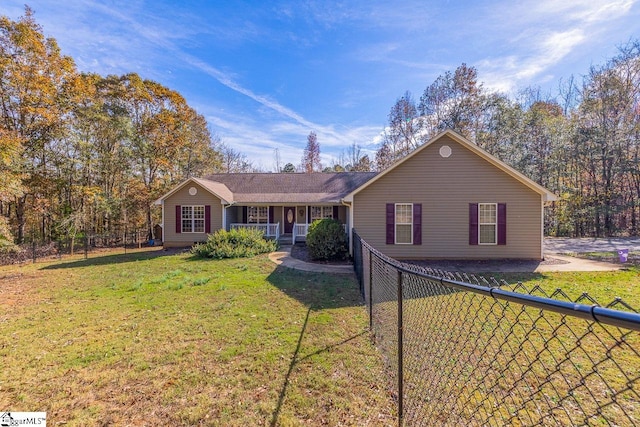 single story home featuring a front lawn and covered porch