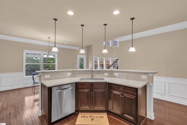 kitchen with hanging light fixtures, sink, stainless steel dishwasher, and dark hardwood / wood-style floors