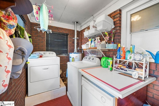 laundry area with separate washer and dryer, crown molding, brick wall, and gas water heater