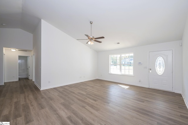 entryway featuring hardwood / wood-style floors, vaulted ceiling, and ceiling fan