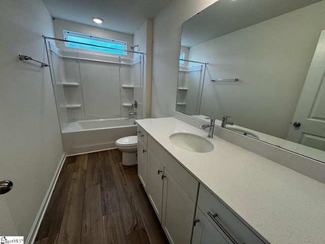 full bathroom with vanity, shower / bathing tub combination, wood-type flooring, and toilet