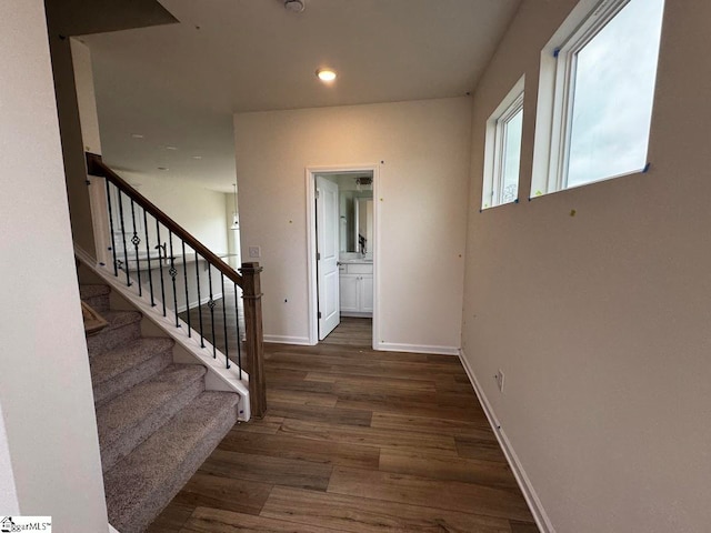 hall with dark hardwood / wood-style floors