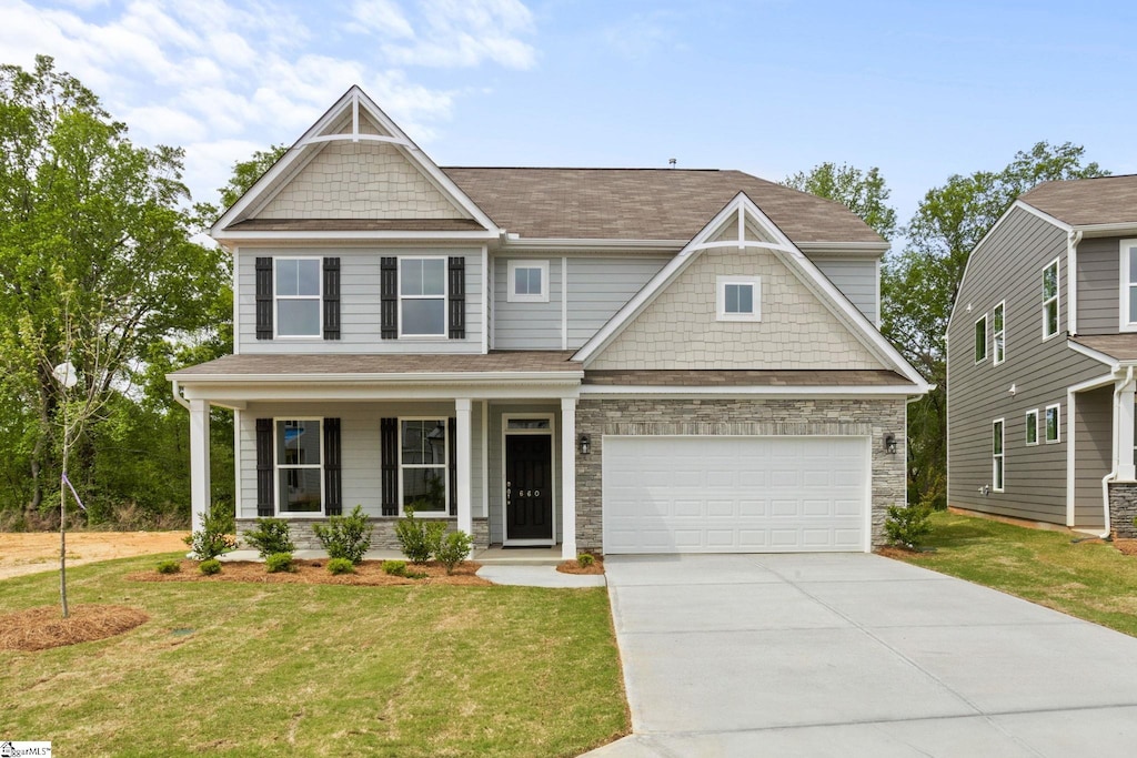 660 Columbus Cir, Simpsonville, SC 29680 - craftsman-style house with a front yard and stone siding