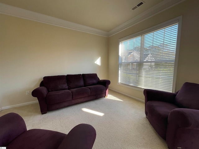 carpeted living room with ornamental molding