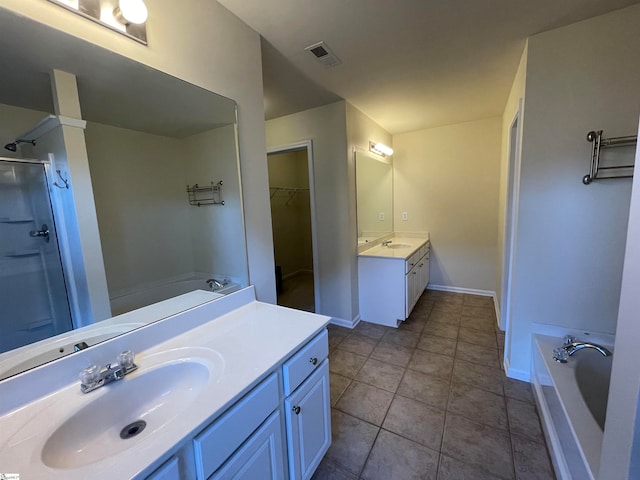 bathroom with tile patterned floors, plus walk in shower, and vanity