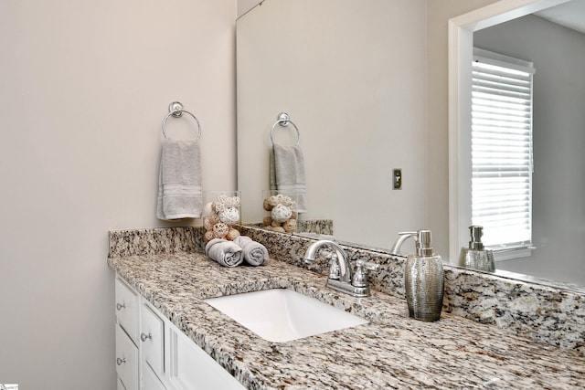 bathroom with vanity and a healthy amount of sunlight