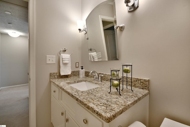 bathroom featuring vanity and a textured ceiling