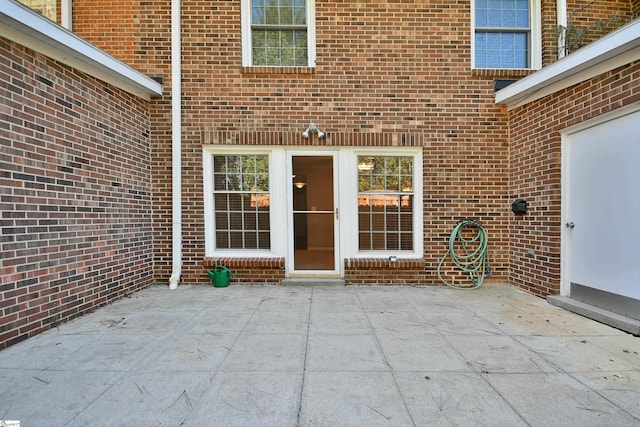 doorway to property with a patio area