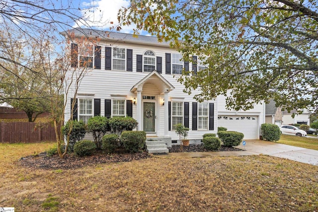 colonial-style house featuring a garage