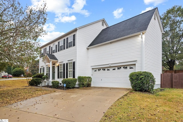 exterior space with a garage and a front lawn