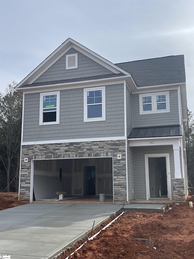 view of front of property with a garage