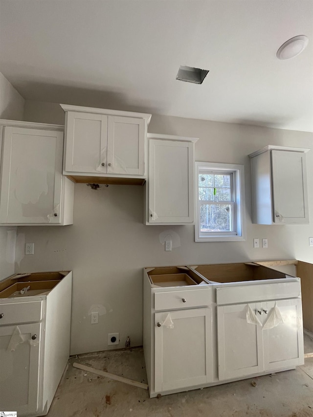 kitchen featuring white cabinets