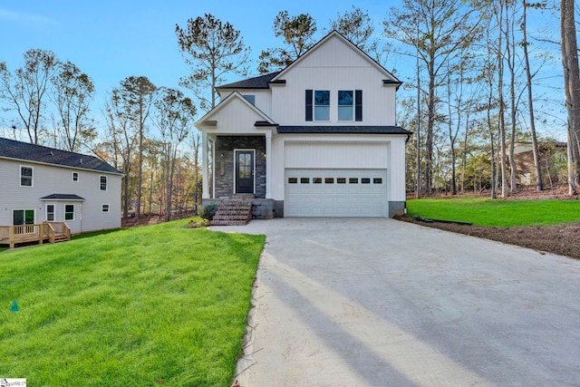 view of front facade with a garage and a front lawn