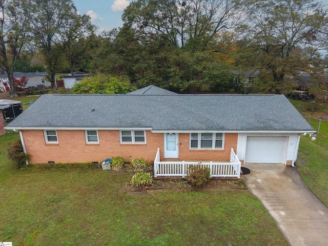 ranch-style house with a garage and a front yard