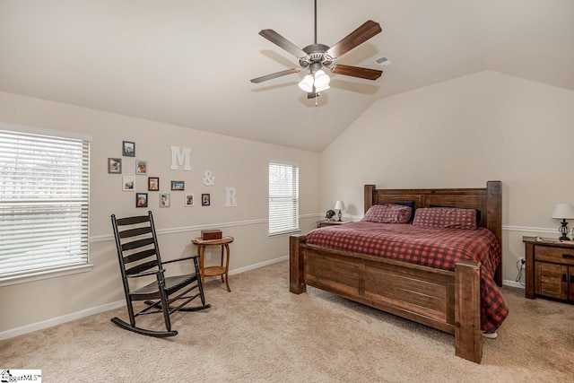 carpeted bedroom featuring lofted ceiling and ceiling fan