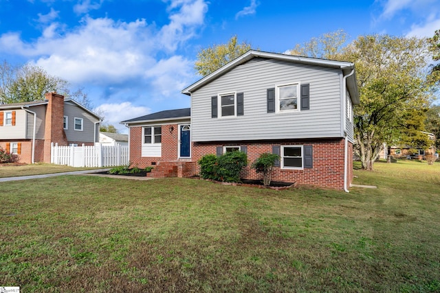 split level home with a front yard