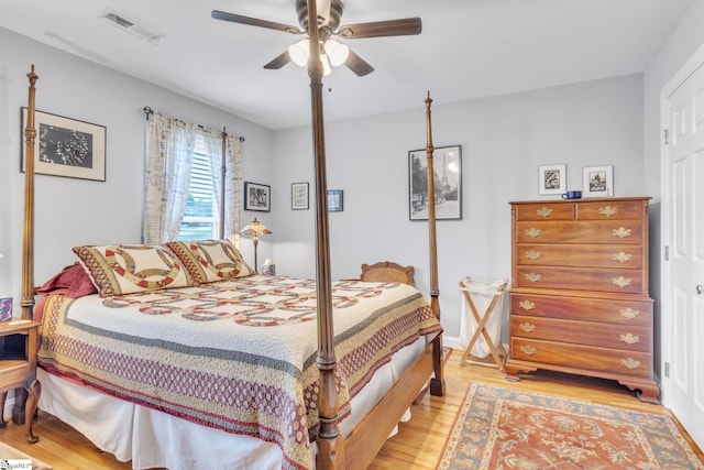 bedroom with light hardwood / wood-style flooring and ceiling fan