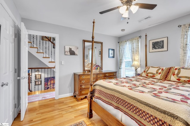 bedroom featuring hardwood / wood-style floors and ceiling fan