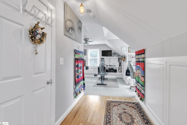 office featuring hardwood / wood-style flooring, ceiling fan, and lofted ceiling