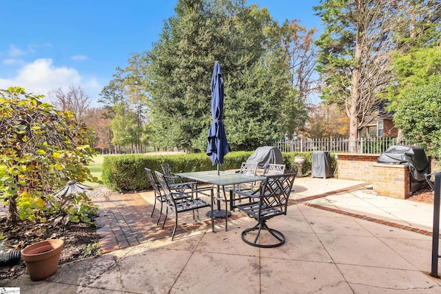 view of patio with a grill