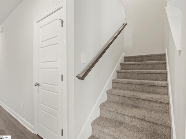 stairs with wood-type flooring