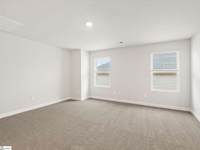 empty room with carpet flooring