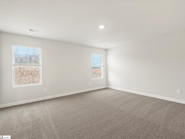 spare room featuring carpet flooring