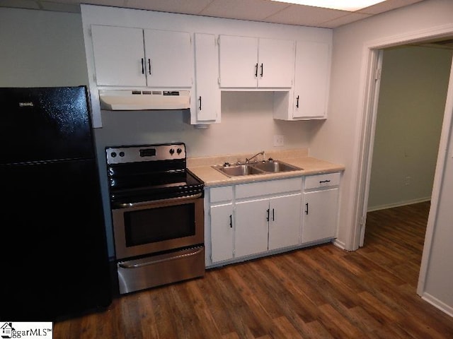 kitchen with stainless steel range with electric stovetop, dark wood-type flooring, black refrigerator, sink, and white cabinetry