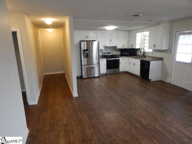 kitchen featuring white cabinets, a textured ceiling, dark wood-type flooring, and black appliances